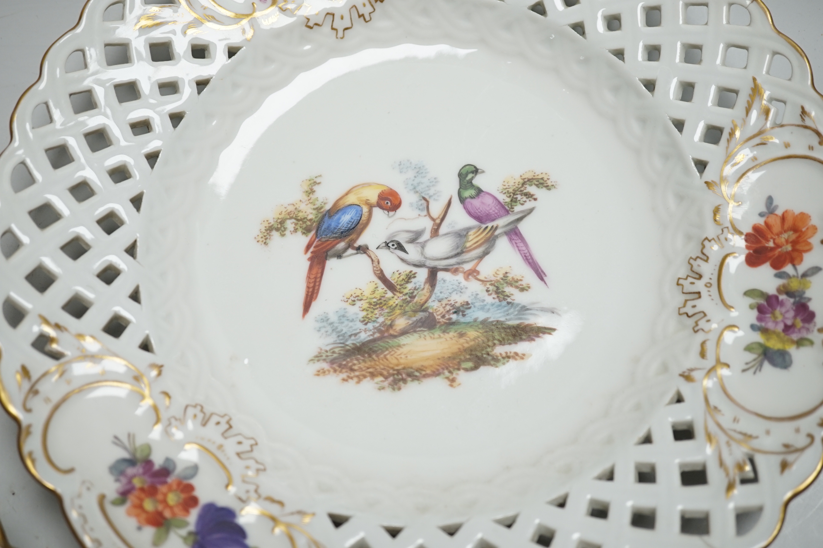 A pair of Meissen outside-decorated bird and flower dishes, 23cm diameter